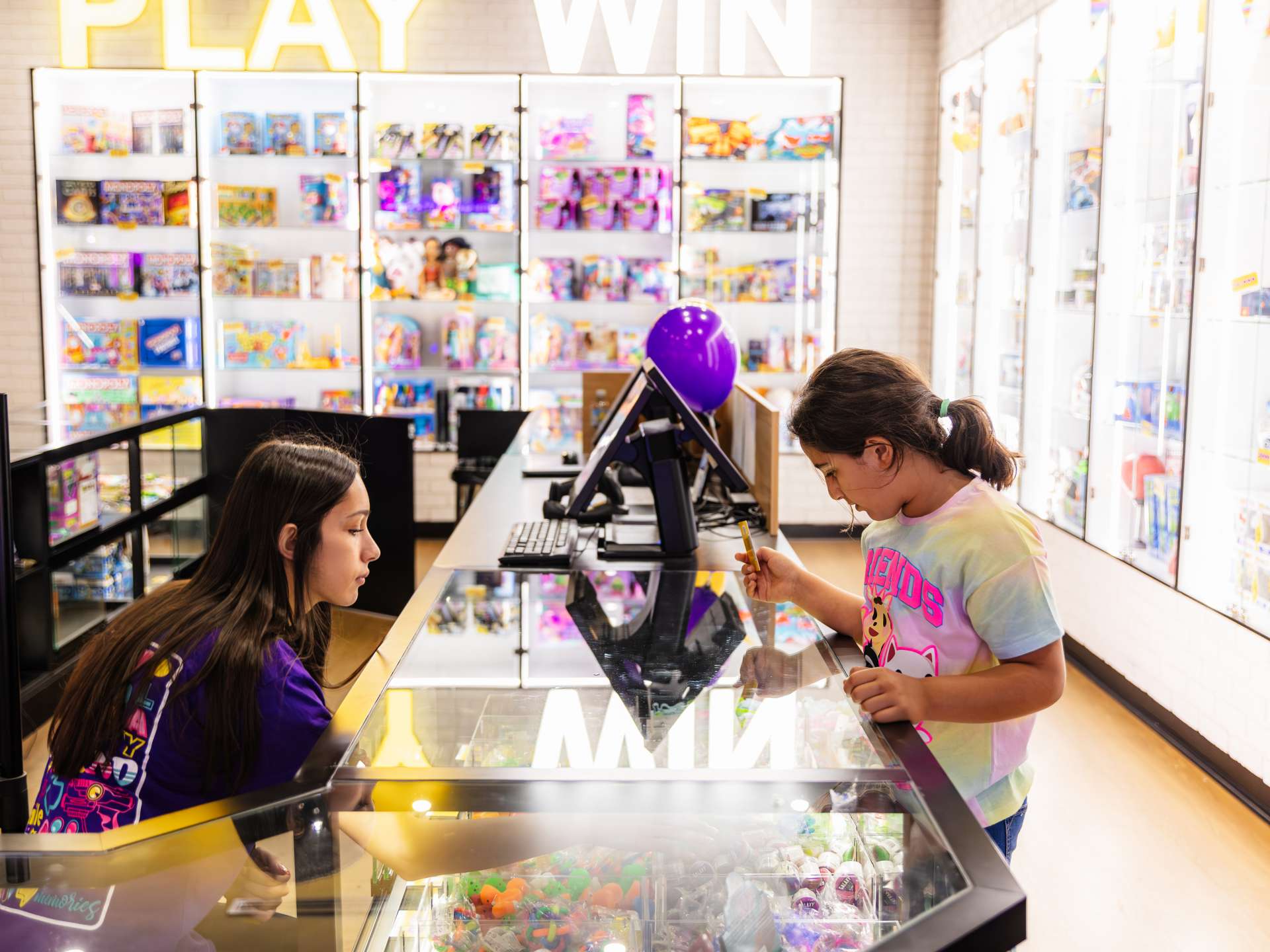 Child at prize redemption counter